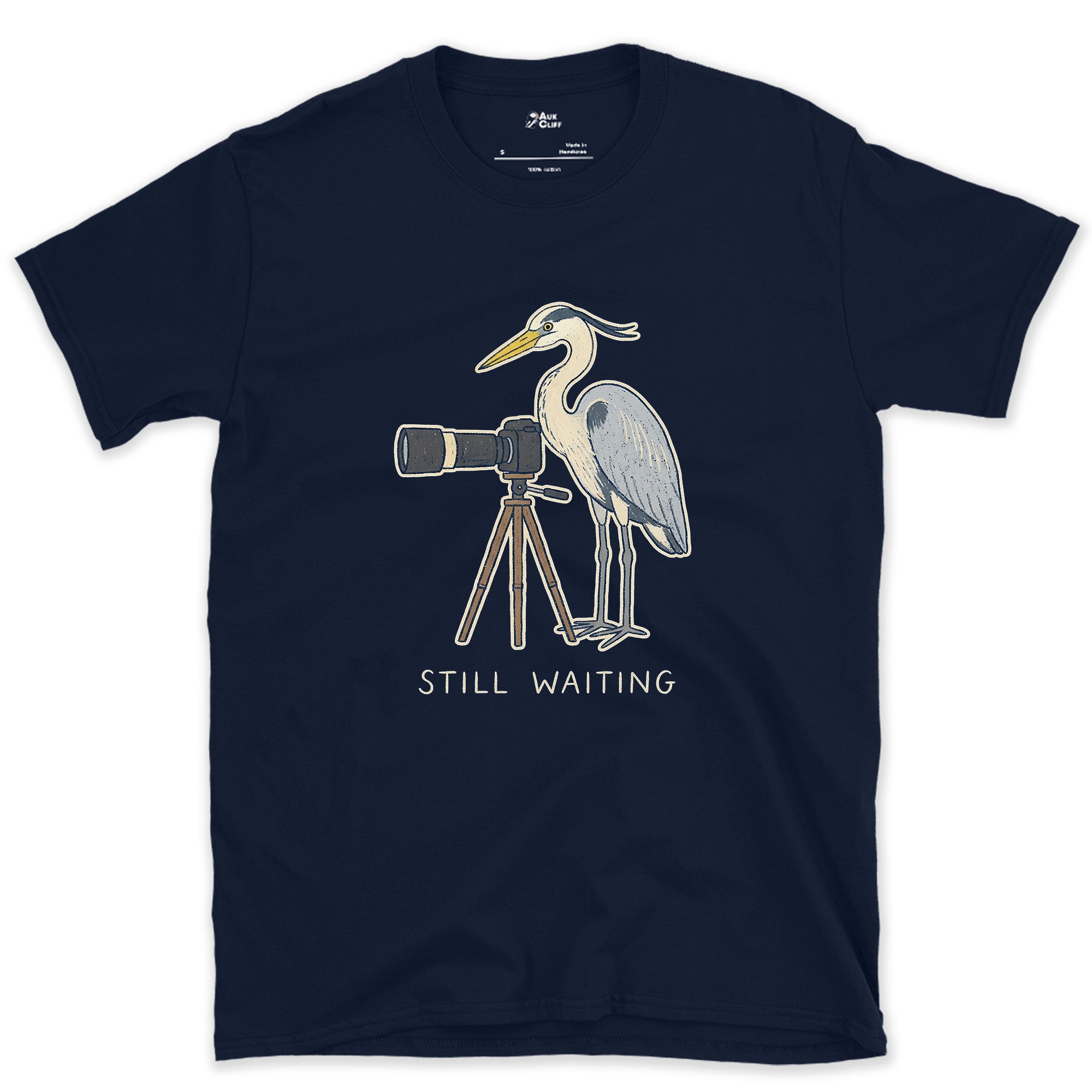 Still Waiting on the Tripod, a Heron Habit design on a Navy Gildan Softstyle t-shirt