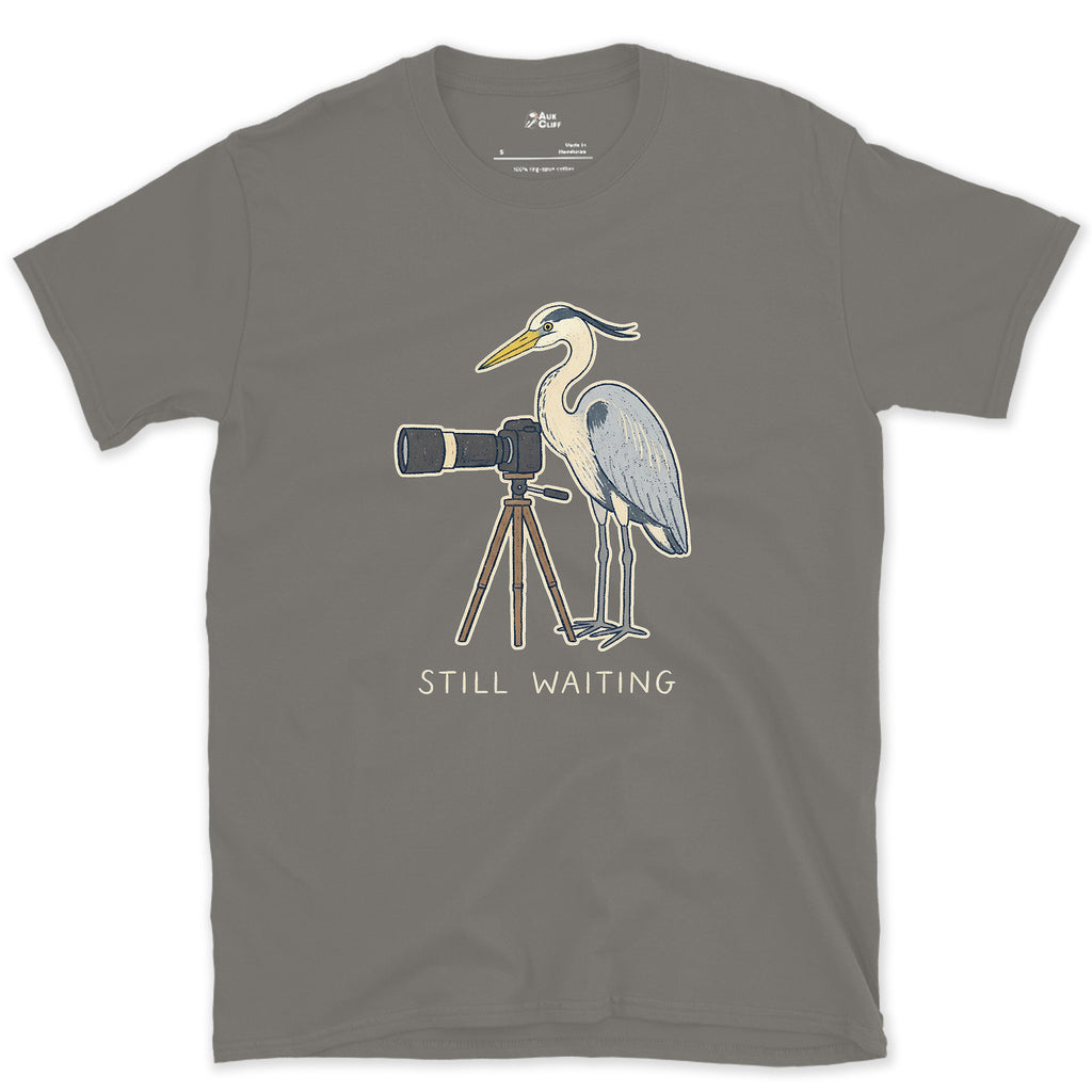 Still Waiting on the Tripod, a Heron Habit design on a Charcoal Gildan Softstyle t-shirt