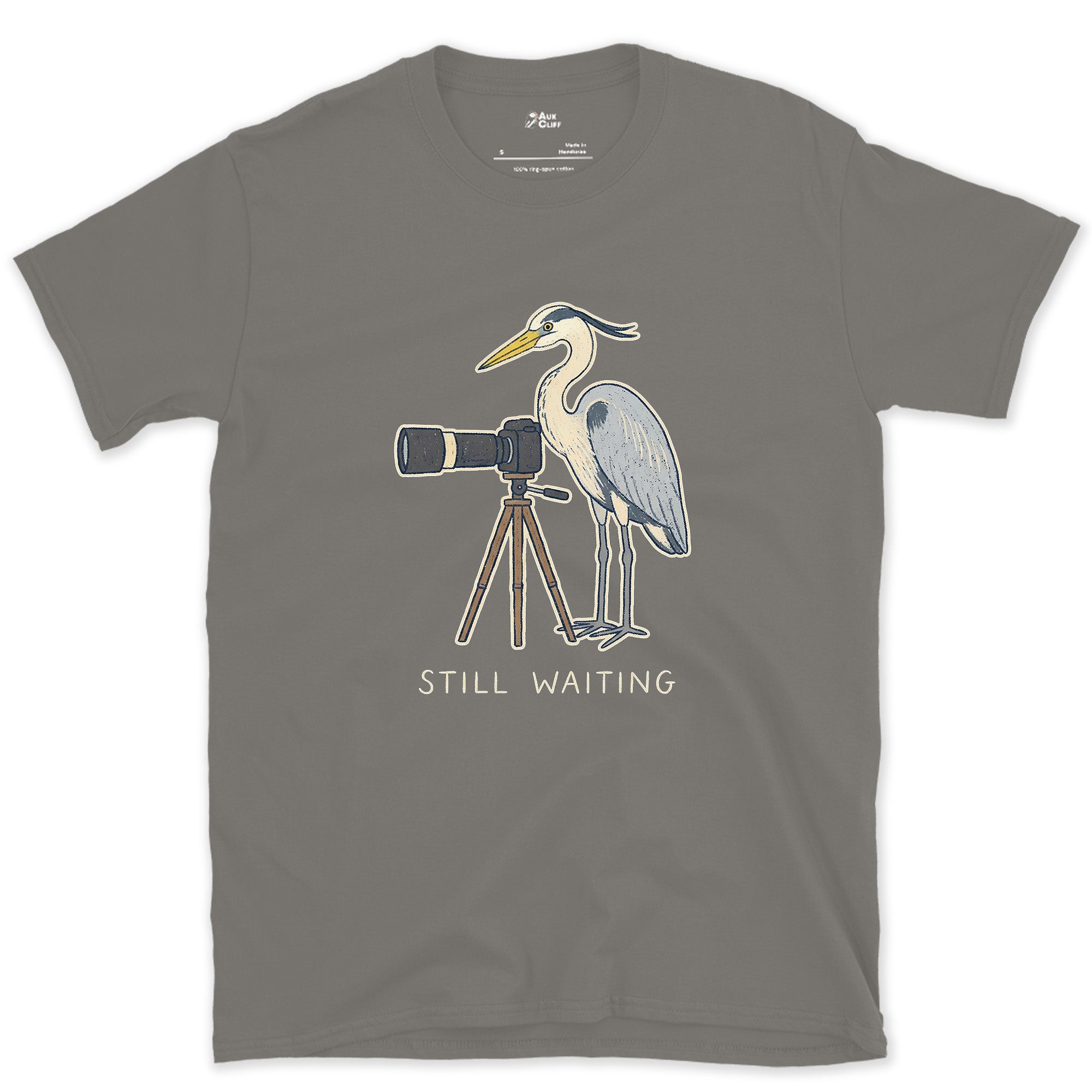 Still Waiting on the Tripod, a Heron Habit design on a Charcoal Gildan Softstyle t-shirt