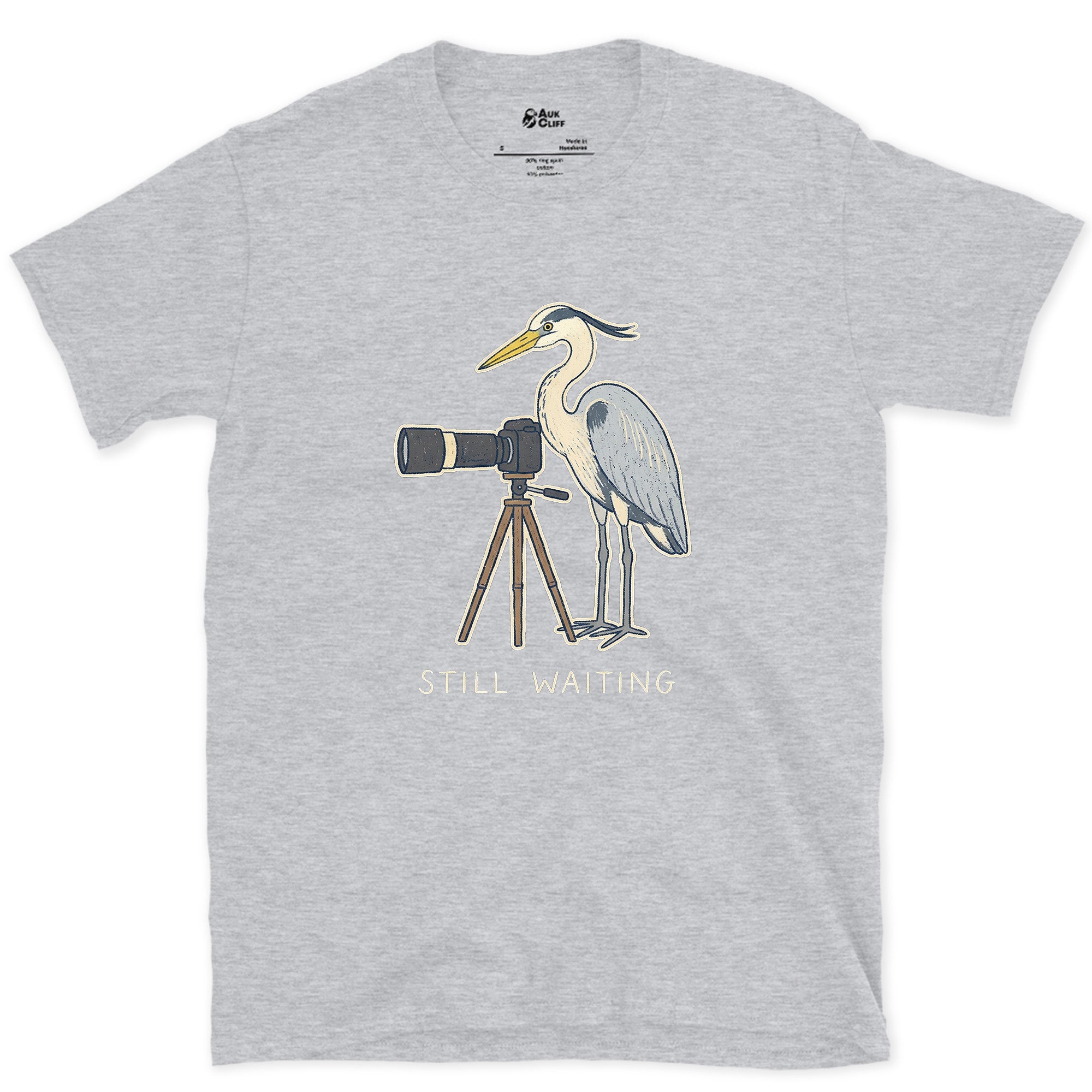 Still Waiting on the Tripod, a Heron Habit design on a Sport Grey Gildan Softstyle t-shirt