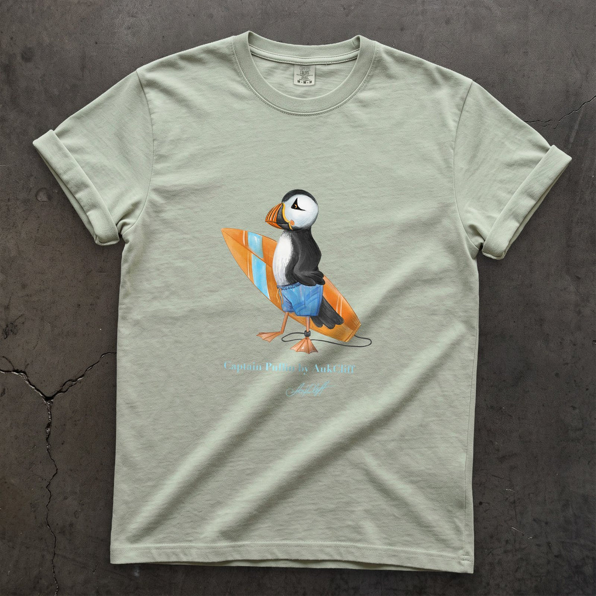 Captain Puffin Surfer on a Bay Comfort Colors t-shirt