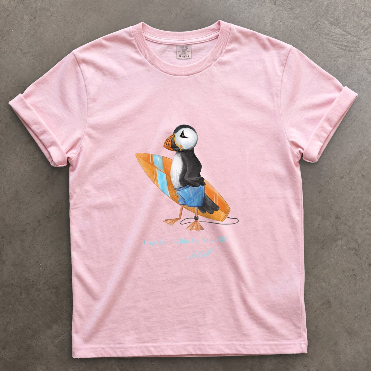 Captain Puffin Surfer on a Blossom Comfort Colors t-shirt