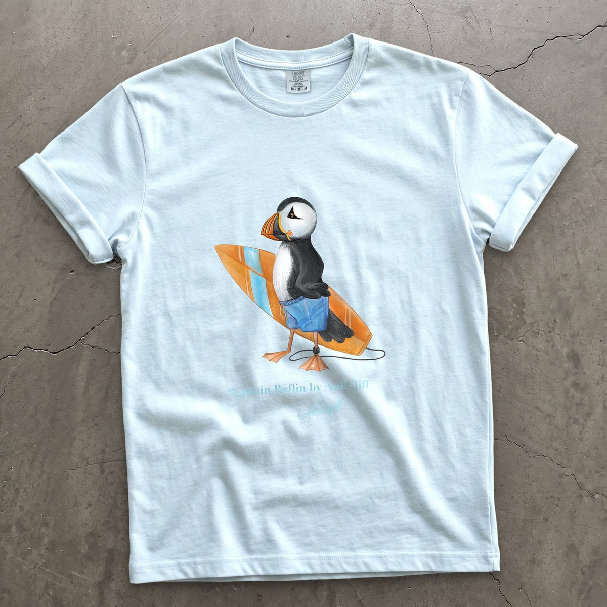 Captain Puffin Surfer on a Chambray Comfort Colors t-shirt