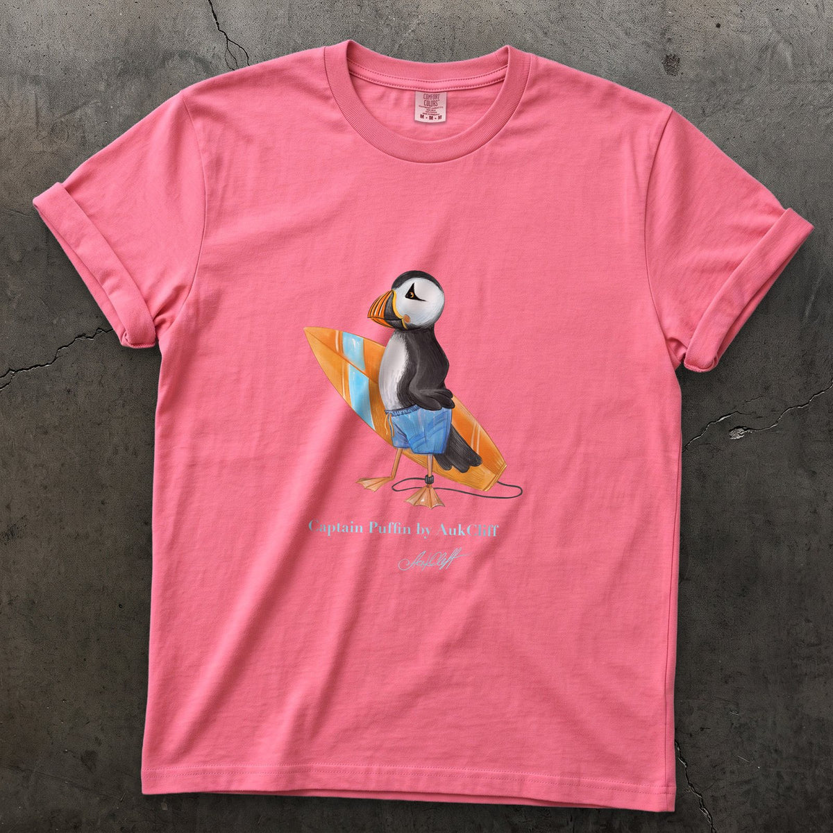 Captain Puffin Surfer on a Crunchberry Comfort Colors t-shirt