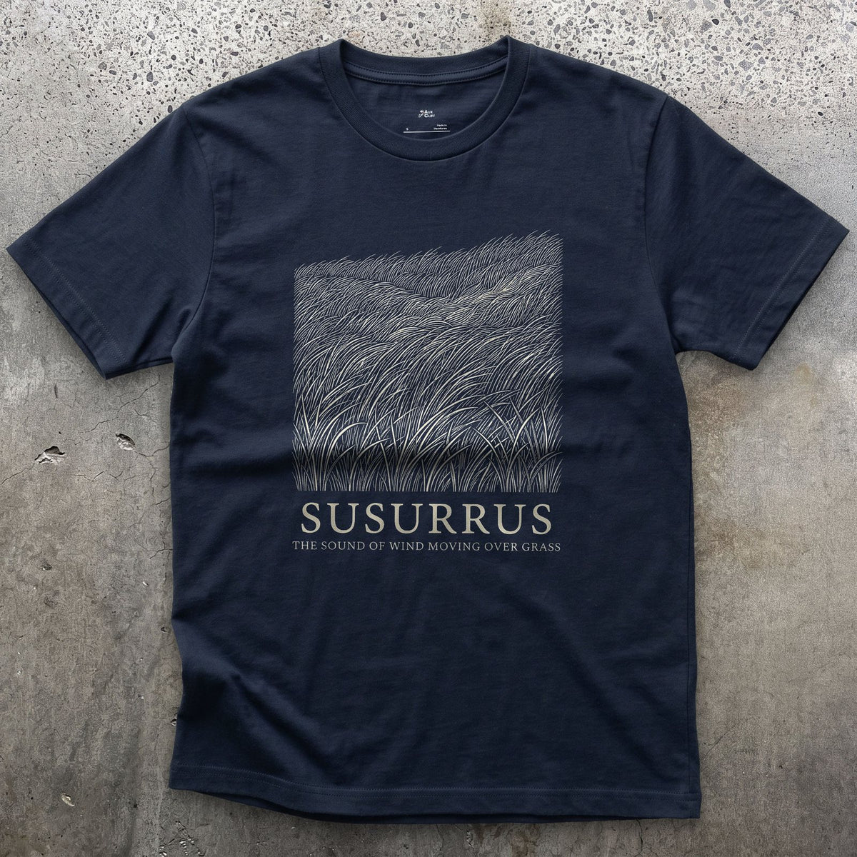 Susurrus, the Sound of Wind Moving Over Grass design on a Navy Gildan Softstyle t-shirt