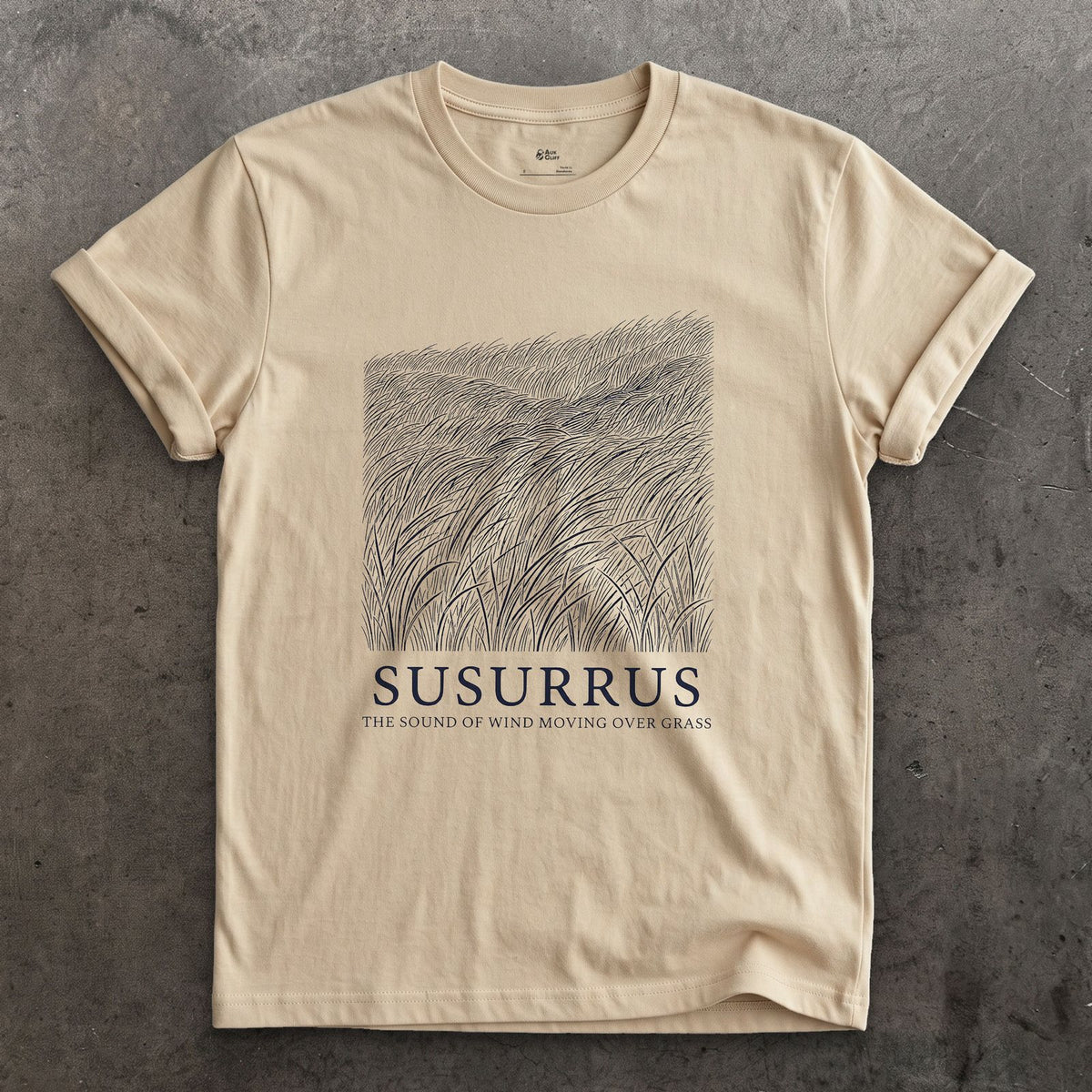 Susurrus, the Sound of Wind Moving Over Grass design on a Sand Gildan Softstyle t-shirt
