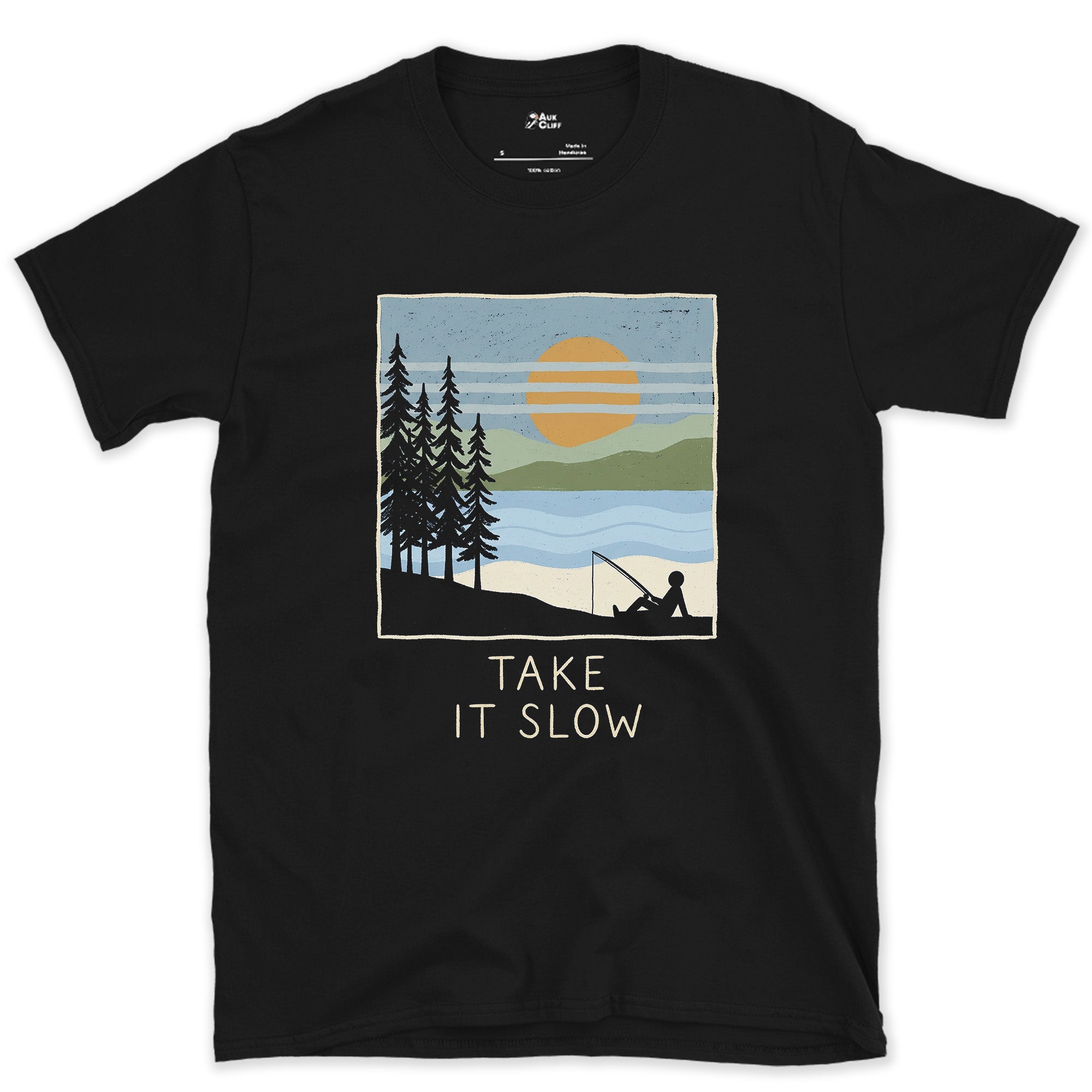 Take It Slow, Angler Under the Pines design on a Black Gildan Softstyle t-shirt