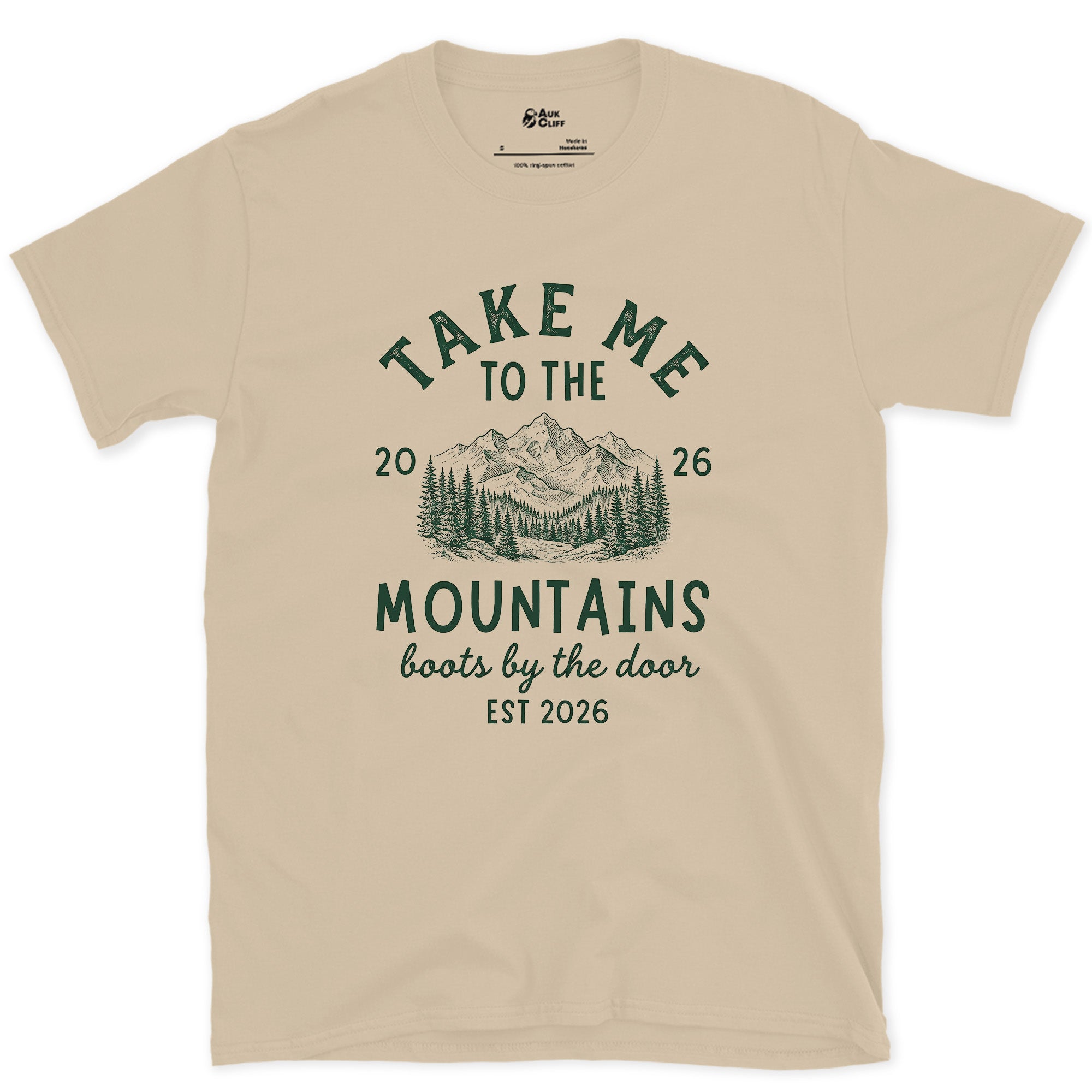 Boots by the Door, Mountain design on a Sand Gildan Softstyle t-shirt