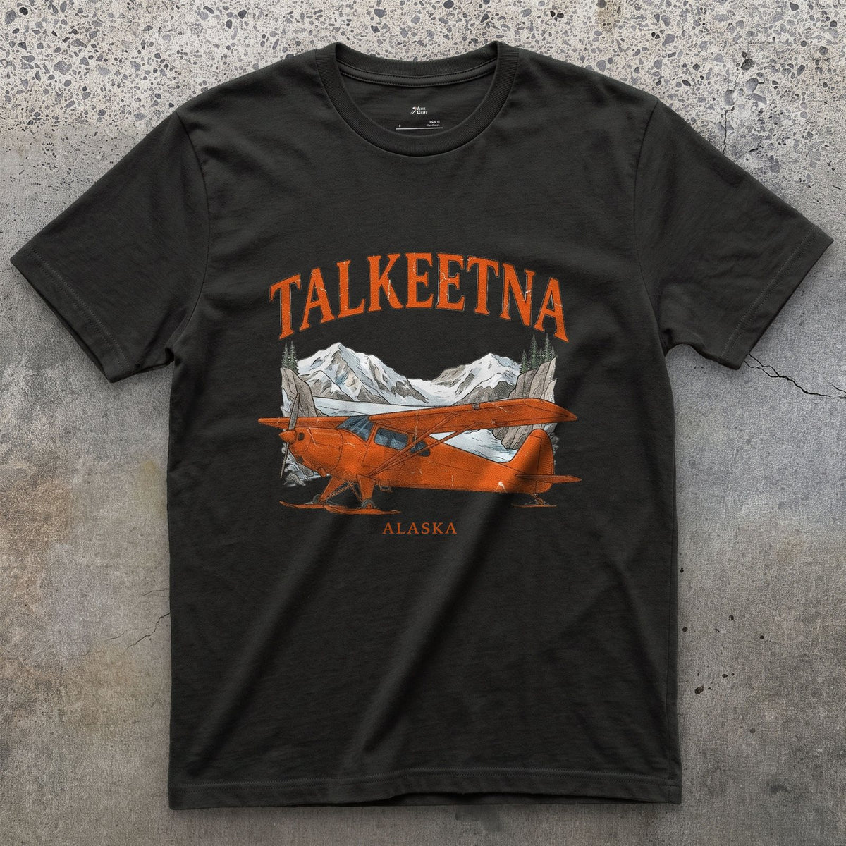 Talkeetna Bush Plane design on a Black Gildan Softstyle t-shirt