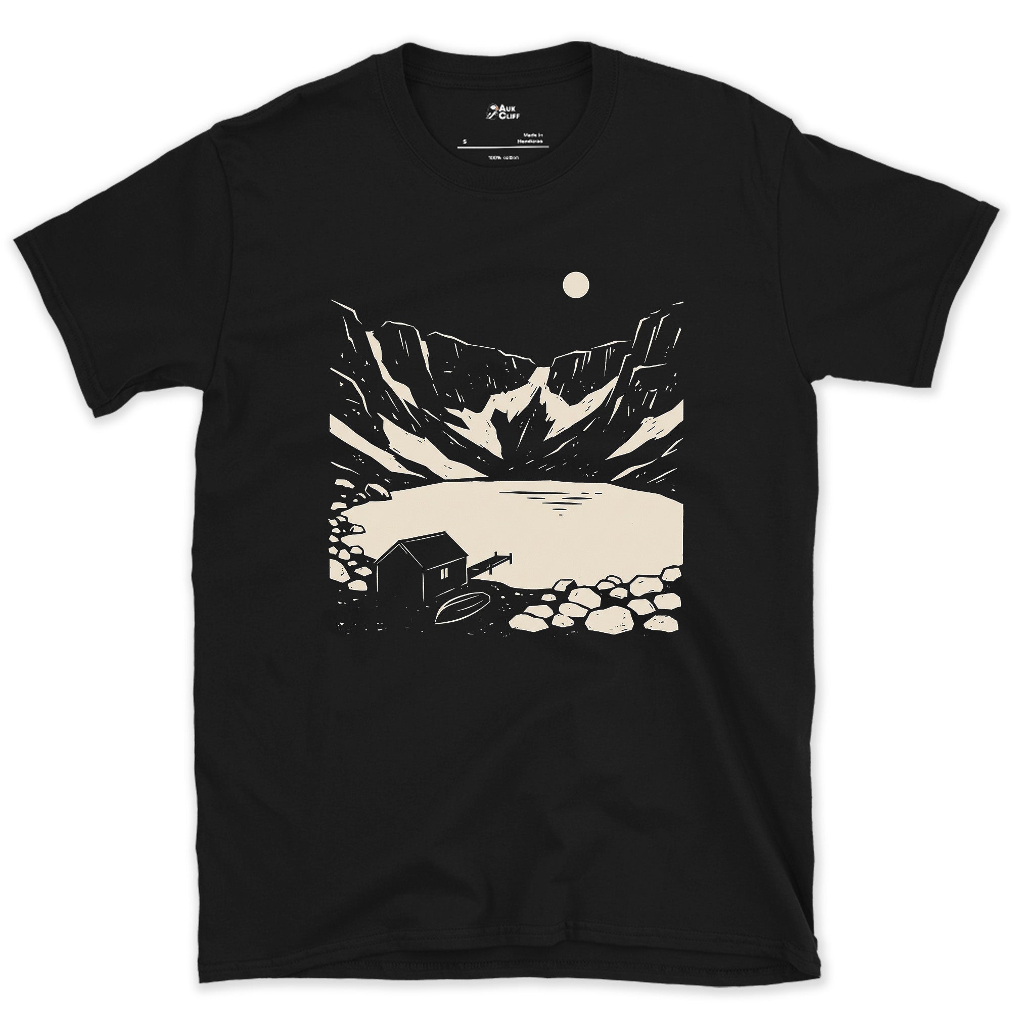 Rocky Shore Cabin Beneath a Climbing Moon design on a Black Gildan Softstyle t-shirt