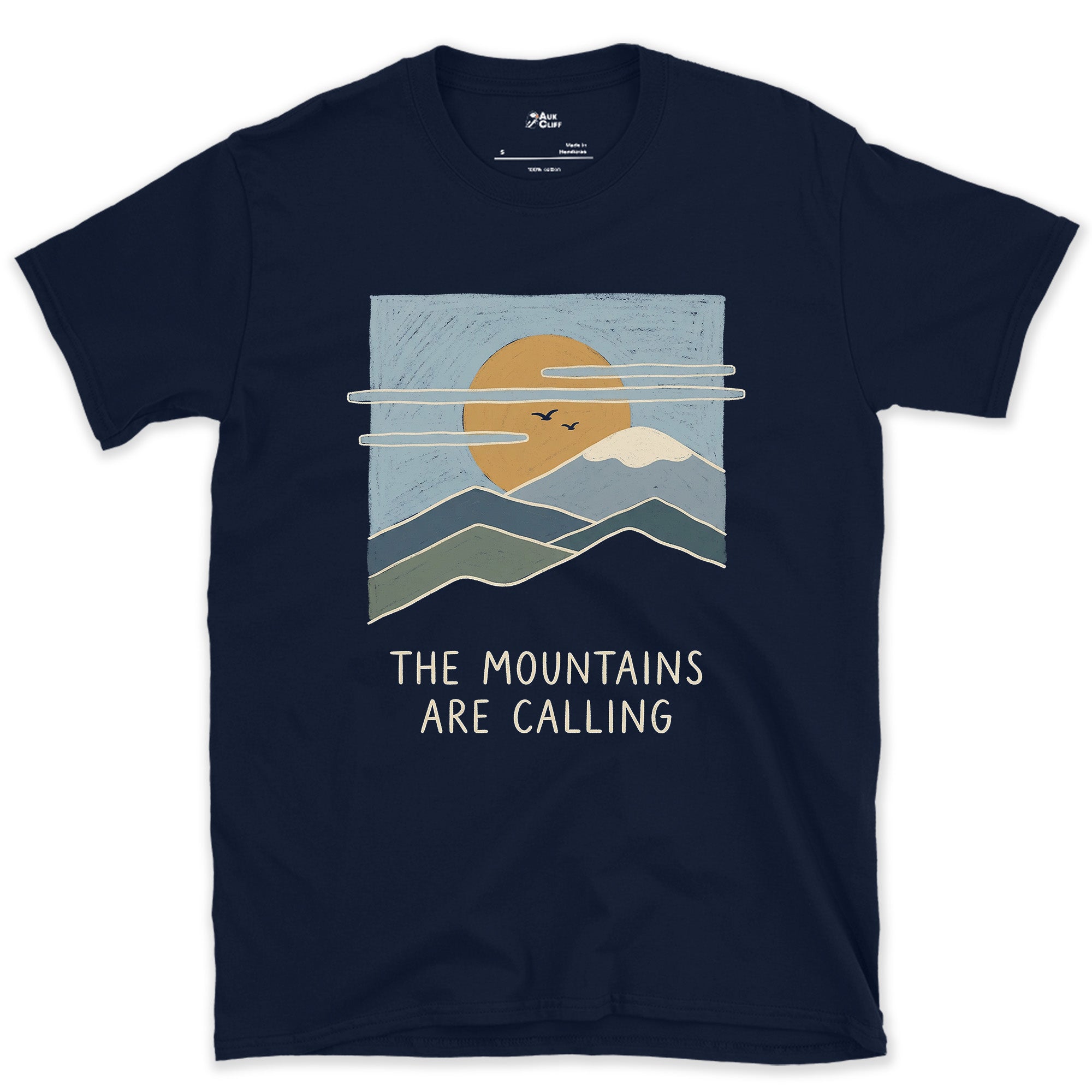 The Mountains Are Calling Over a Range at Sunset design on a Navy Gildan Softstyle t-shirt
