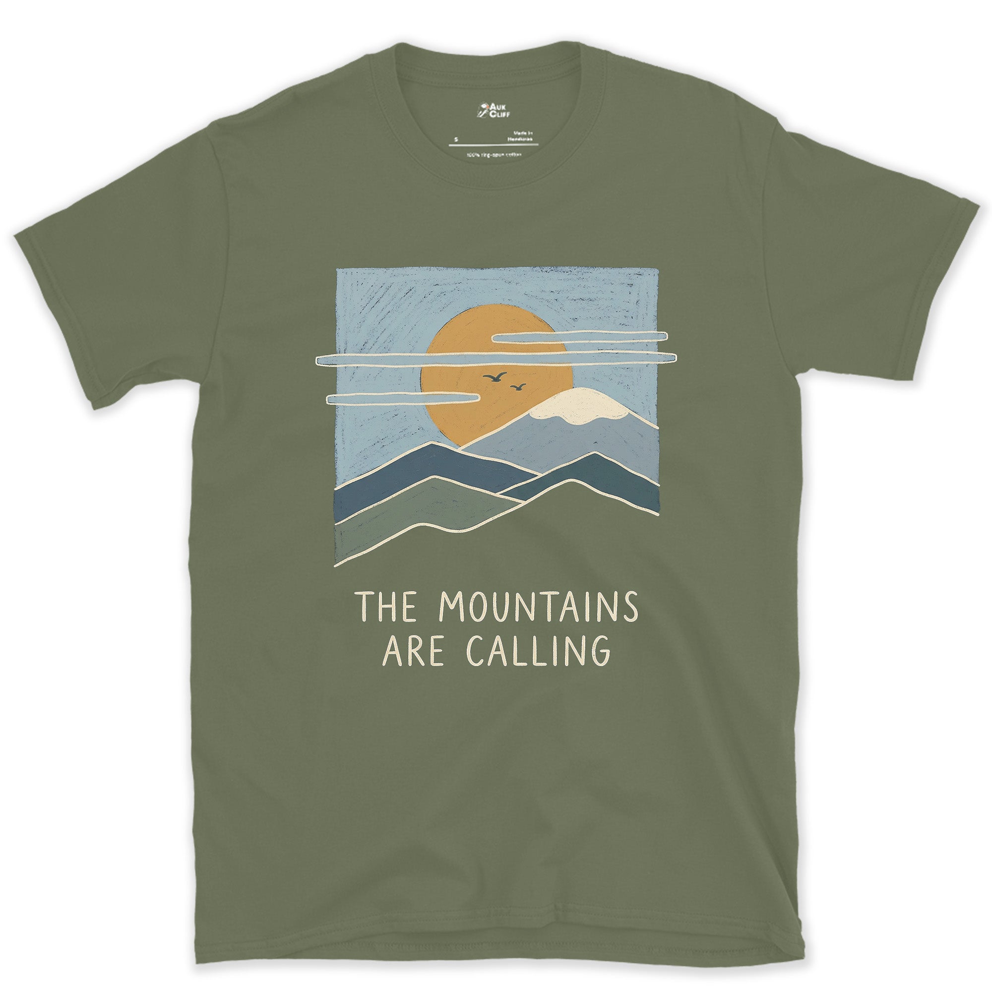 The Mountains Are Calling Over a Range at Sunset design on a Military Green Gildan Softstyle t-shirt
