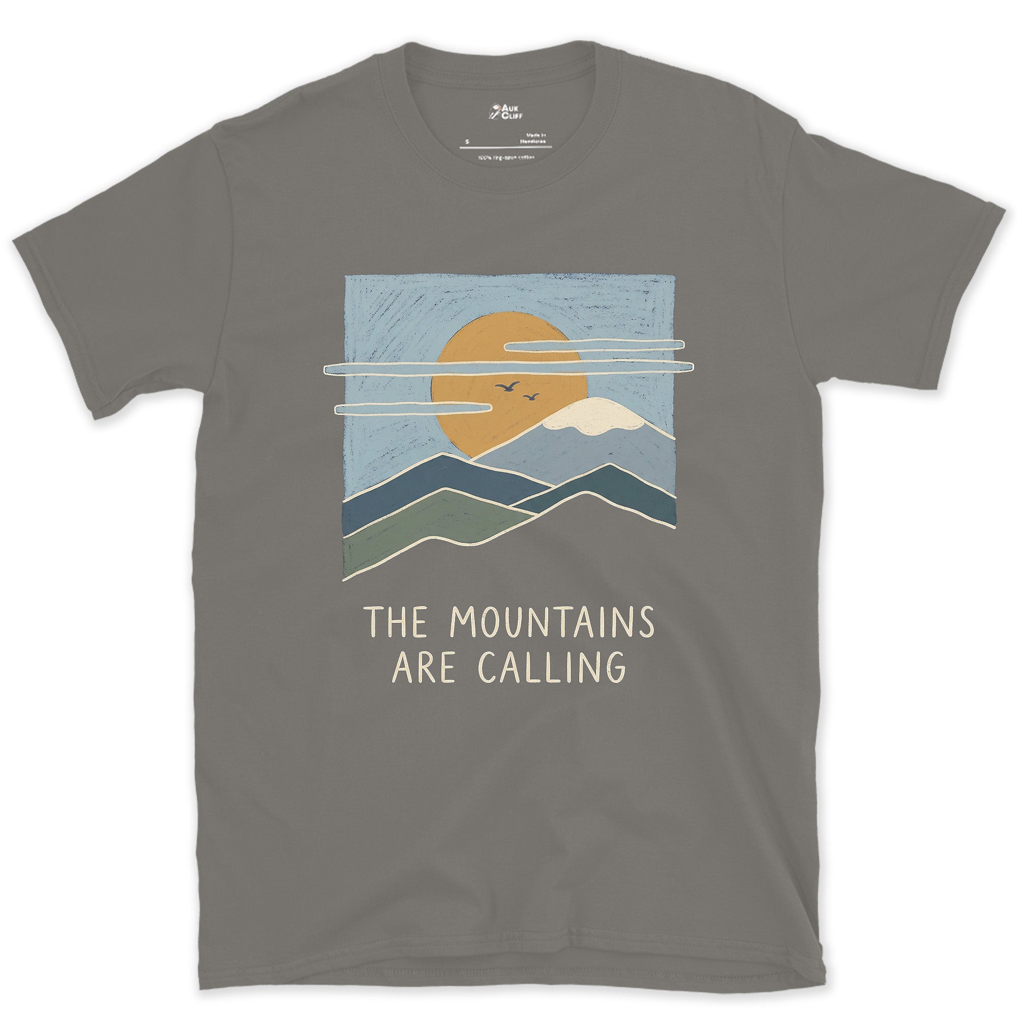 The Mountains Are Calling Over a Range at Sunset design on a Charcoal Gildan Softstyle t-shirt