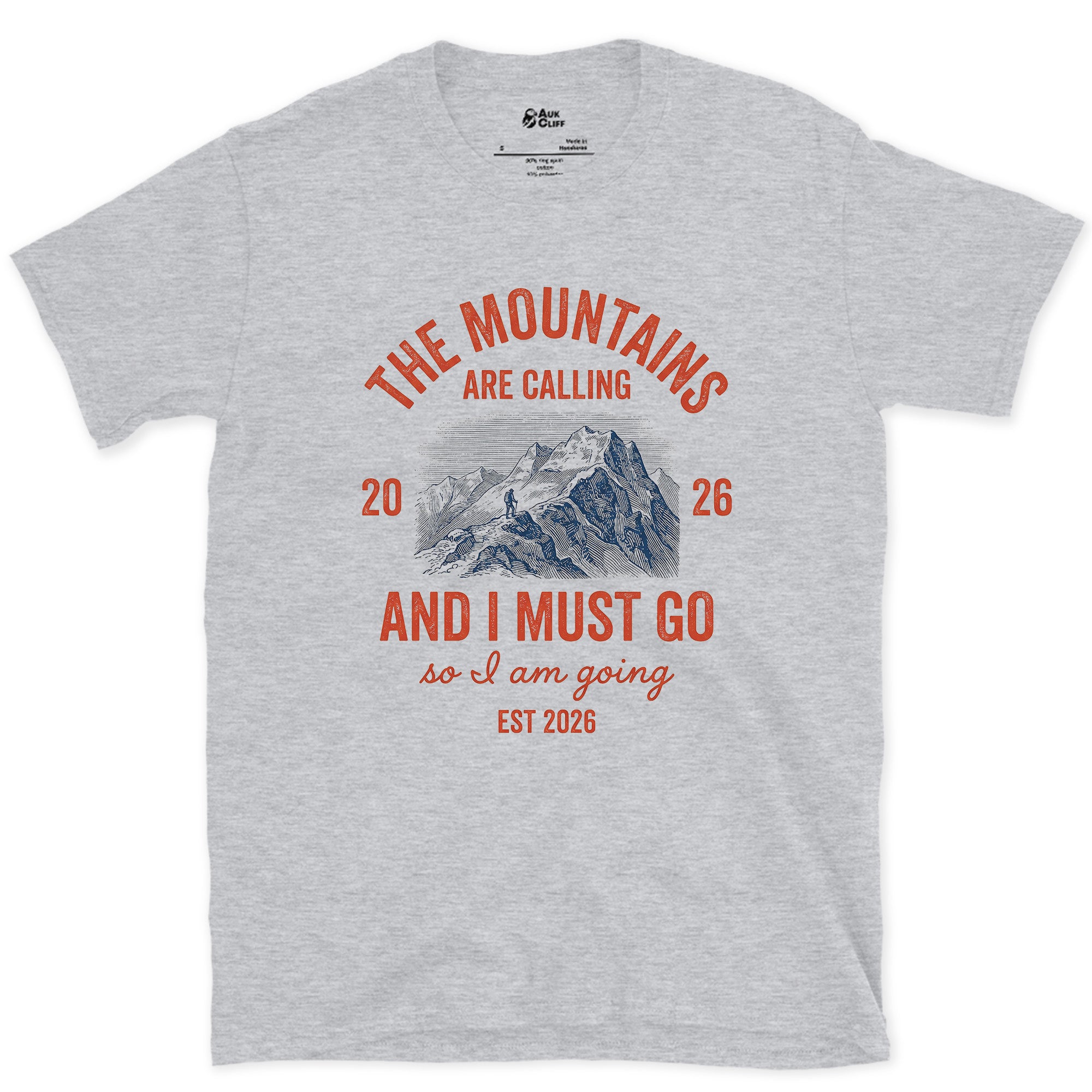 The Mountains Are Calling, So I Am Going design on a Sport Grey Gildan Softstyle t-shirt