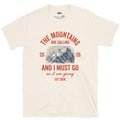 The Mountains Are Calling, So I Am Going design on a Natural Gildan Softstyle t-shirt
