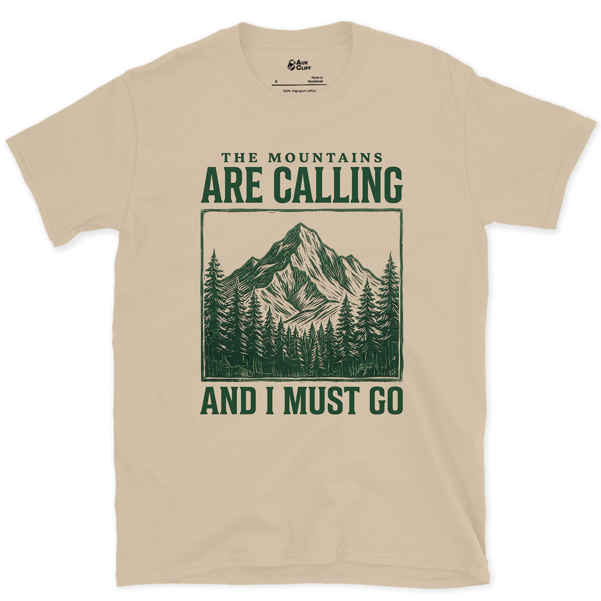 The Mountains Are Calling design on a Sand Gildan Softstyle t-shirt