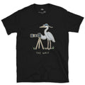 The Wait, Heron With a Tripod design on a Black Gildan Softstyle t-shirt