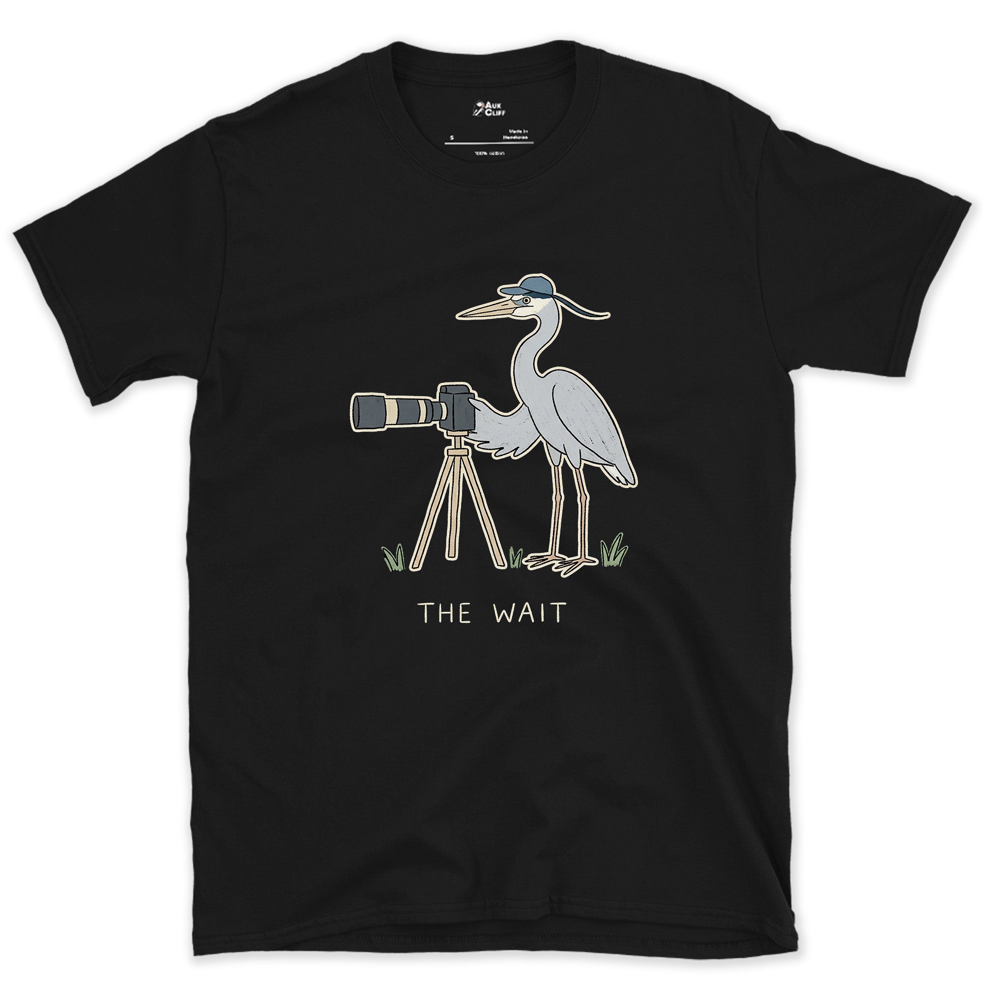 The Wait, Heron With a Tripod design on a Black Gildan Softstyle t-shirt