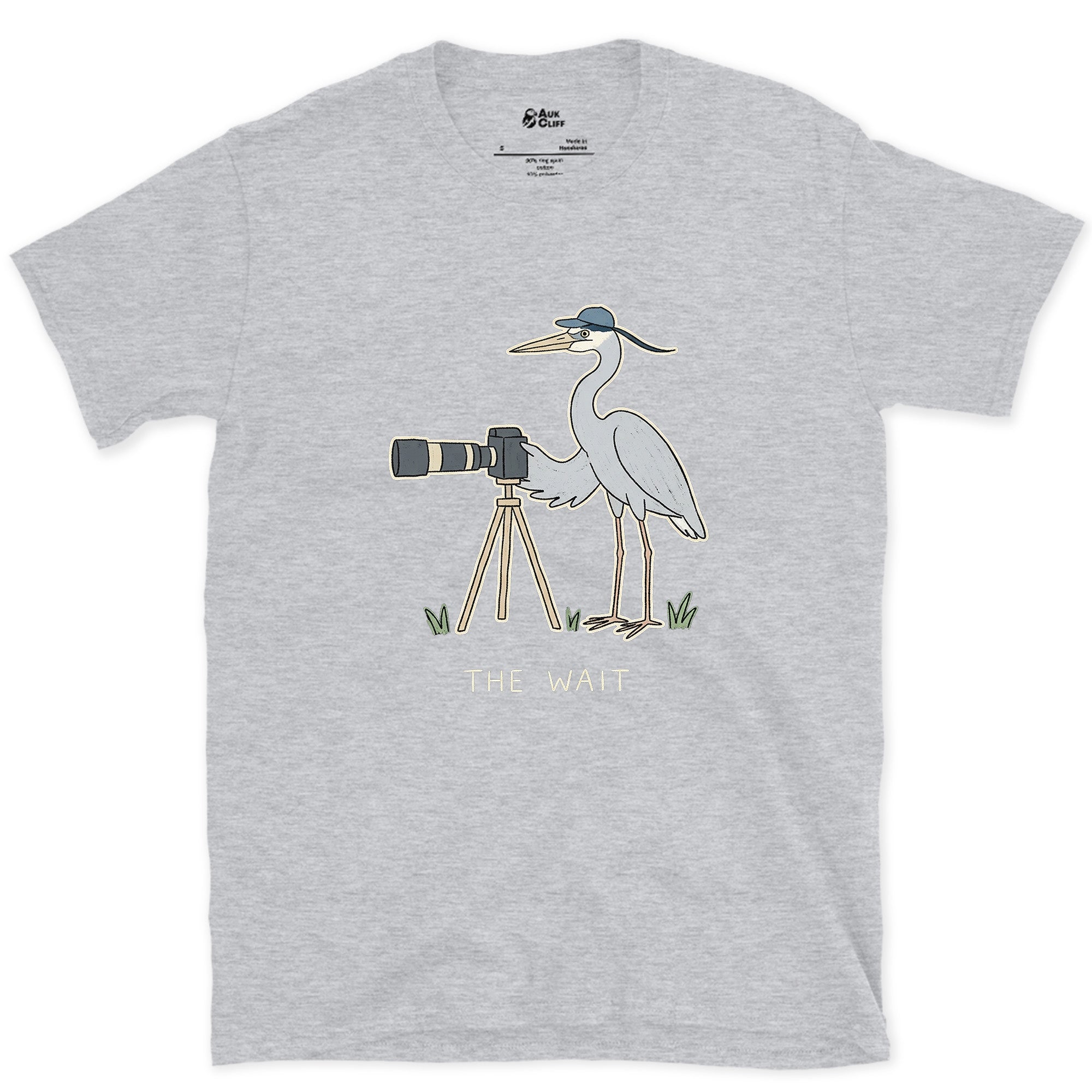 The Wait, Heron With a Tripod design on a Sport Grey Gildan Softstyle t-shirt