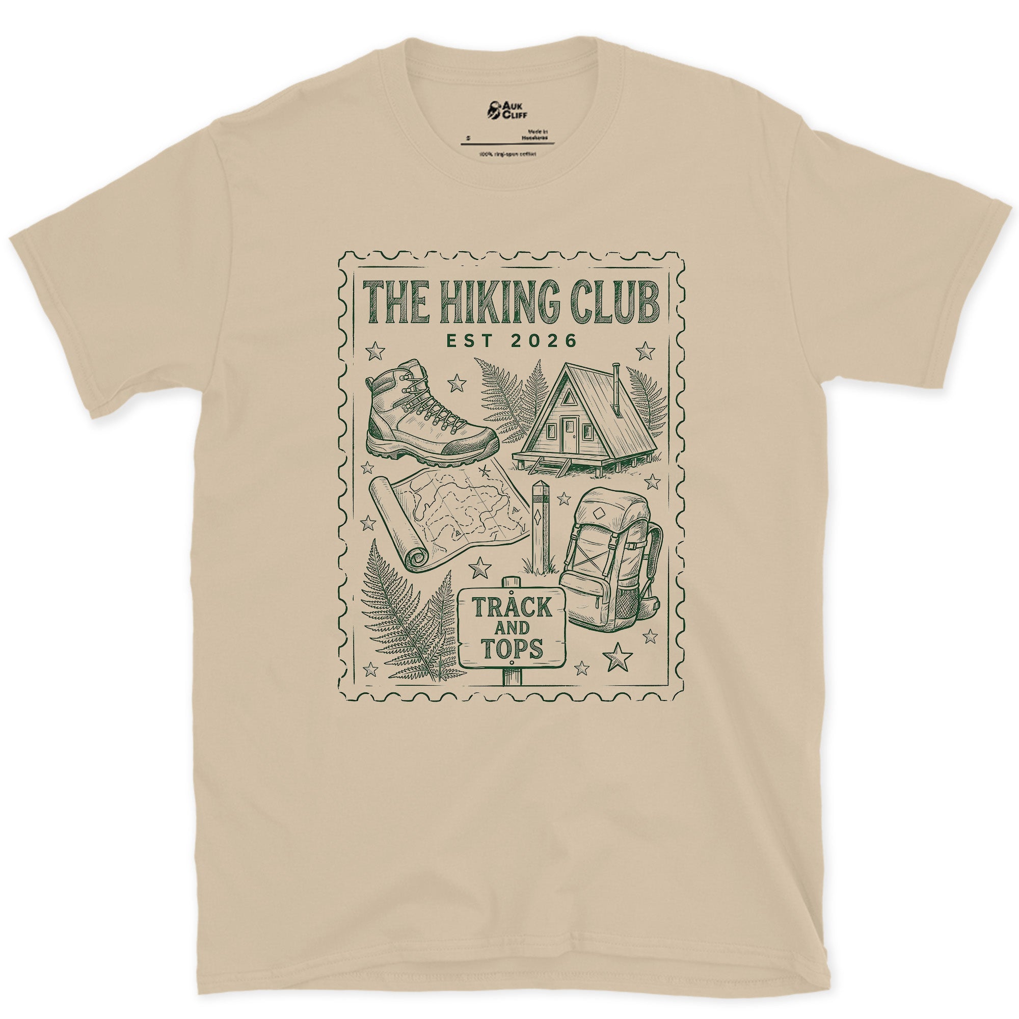 Track and Tops, Boot and Backpack design on a Sand Gildan Softstyle t-shirt