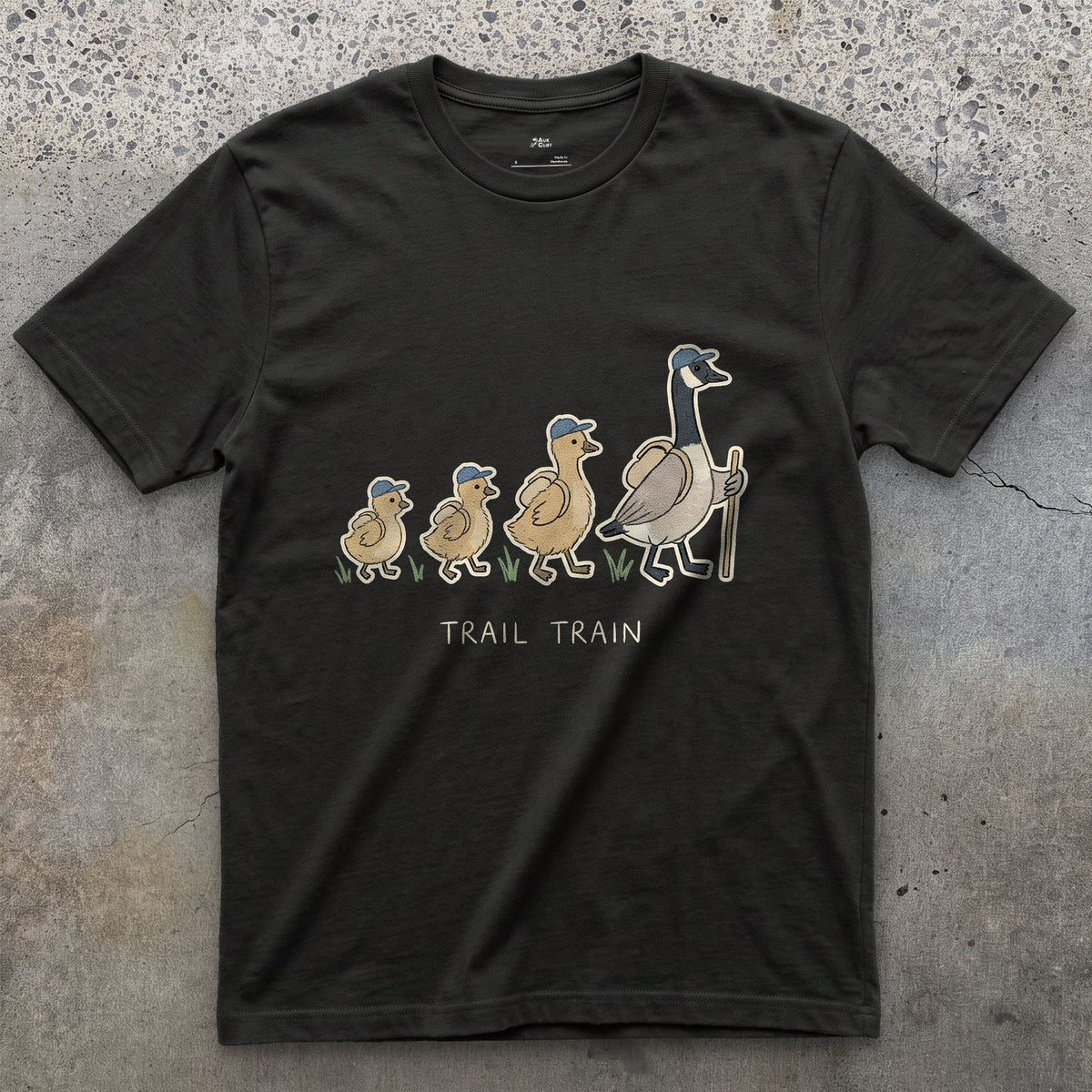 The Trail Train, Goose and Goslings design on a Black Gildan Softstyle t-shirt