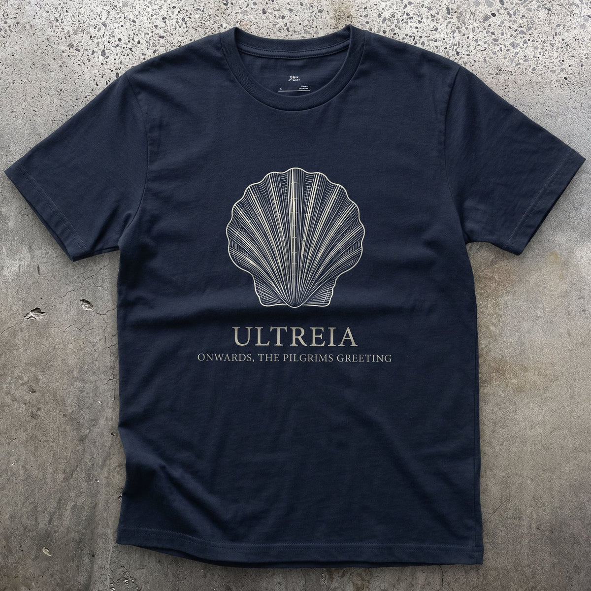 Ultreia, Onwards, the Pilgrim's Greeting design on a Navy Gildan Softstyle t-shirt
