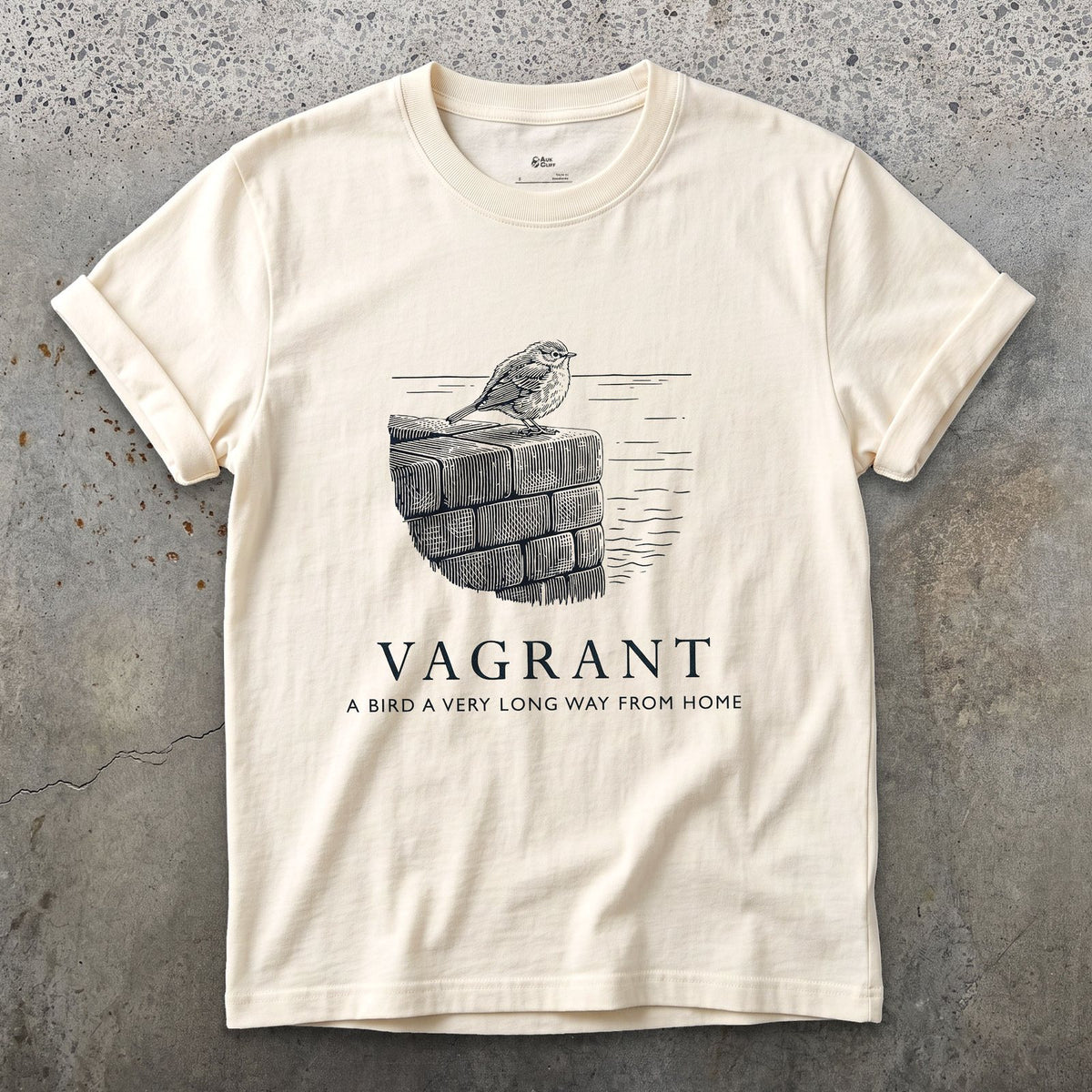 Vagrant, a Bird a Very Long Way From Home design on a Natural Gildan Softstyle t-shirt