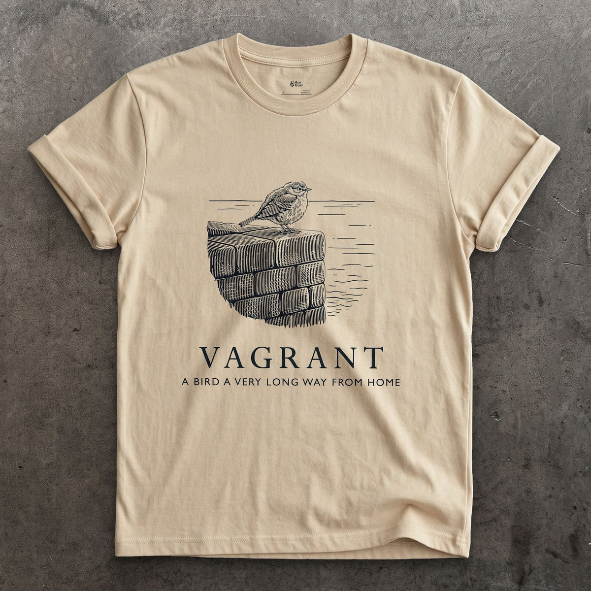 Vagrant, a Bird a Very Long Way From Home design on a Sand Gildan Softstyle t-shirt