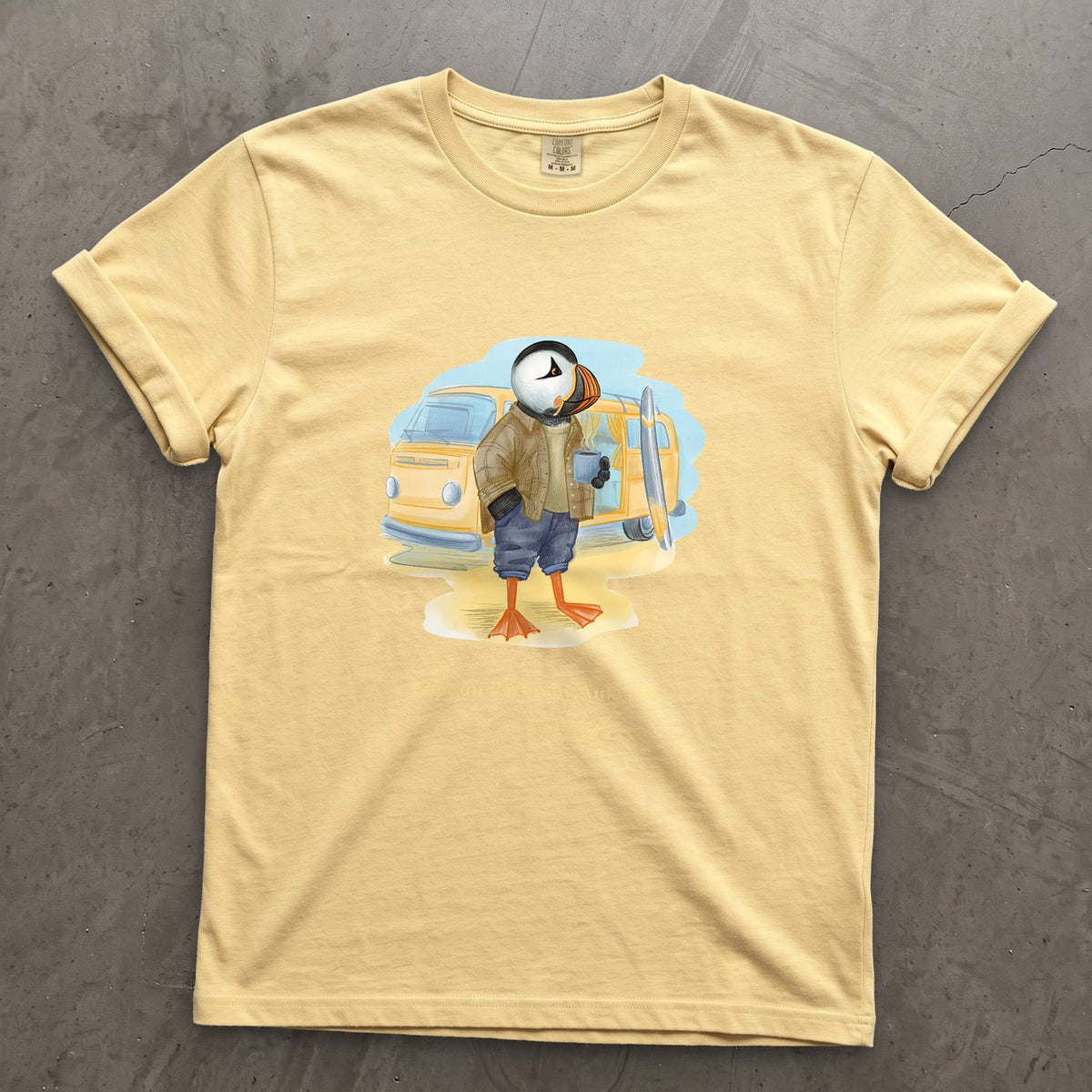 Captain Puffin Van Life Surfer on a Butter Comfort Colors t-shirt