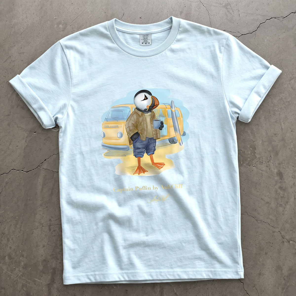 Captain Puffin Van Life Surfer on a Chambray Comfort Colors t-shirt