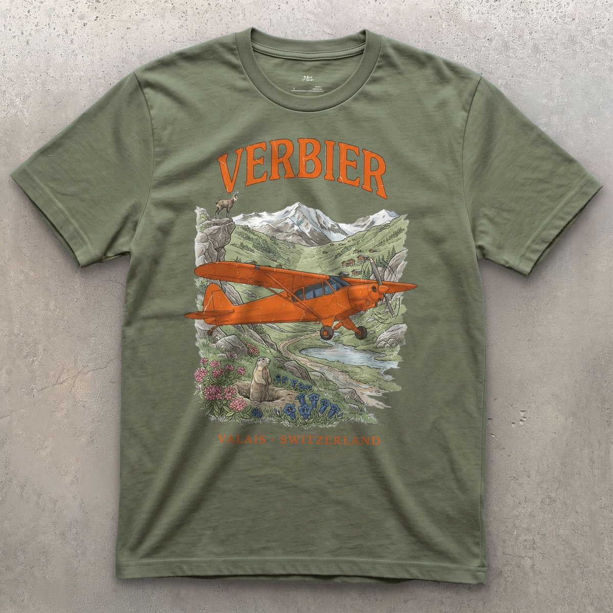 Verbier Bush Plane design on a Military Green Gildan Softstyle t-shirt