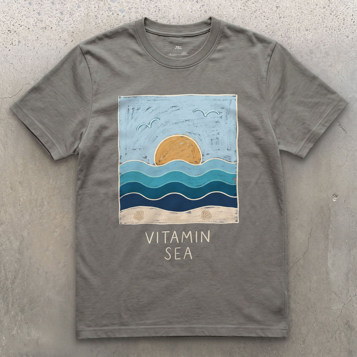 Vitamin Sea, Layered Waves and Shells design on a Charcoal Gildan Softstyle t-shirt