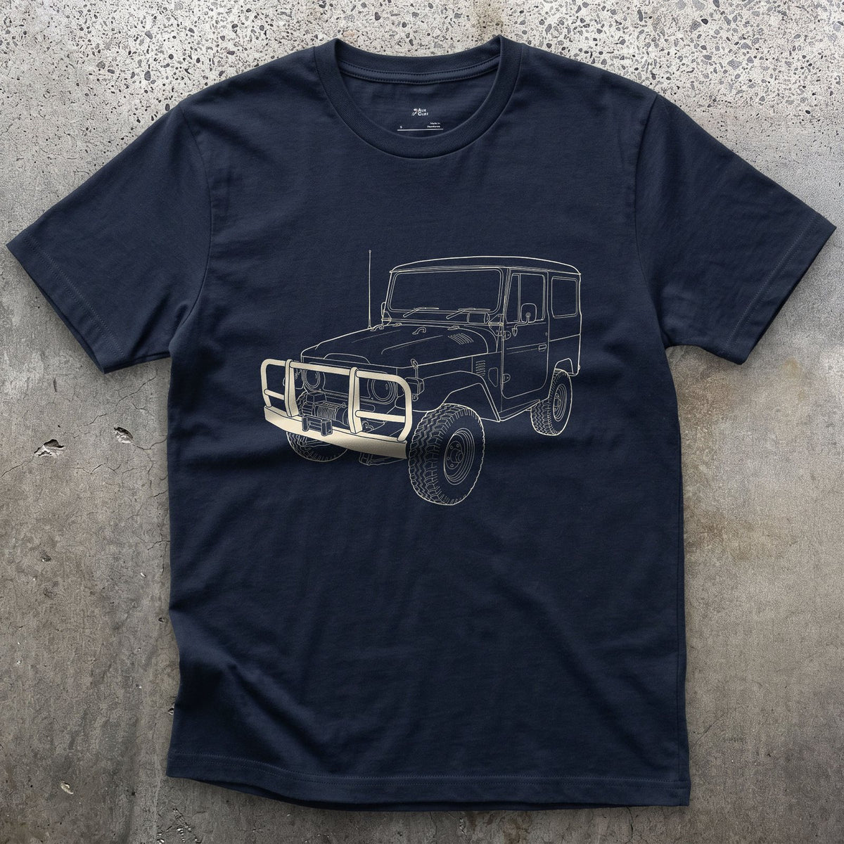 Creases Picked Out by Hand, 4x4 Wagon design on a Navy Gildan Softstyle t-shirt