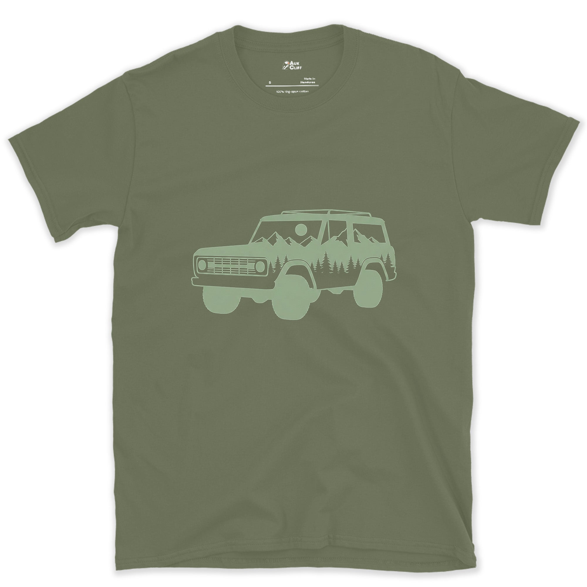 Mountain and Pines Living Inside the Wagon design on a Military Green Gildan Softstyle t-shirt