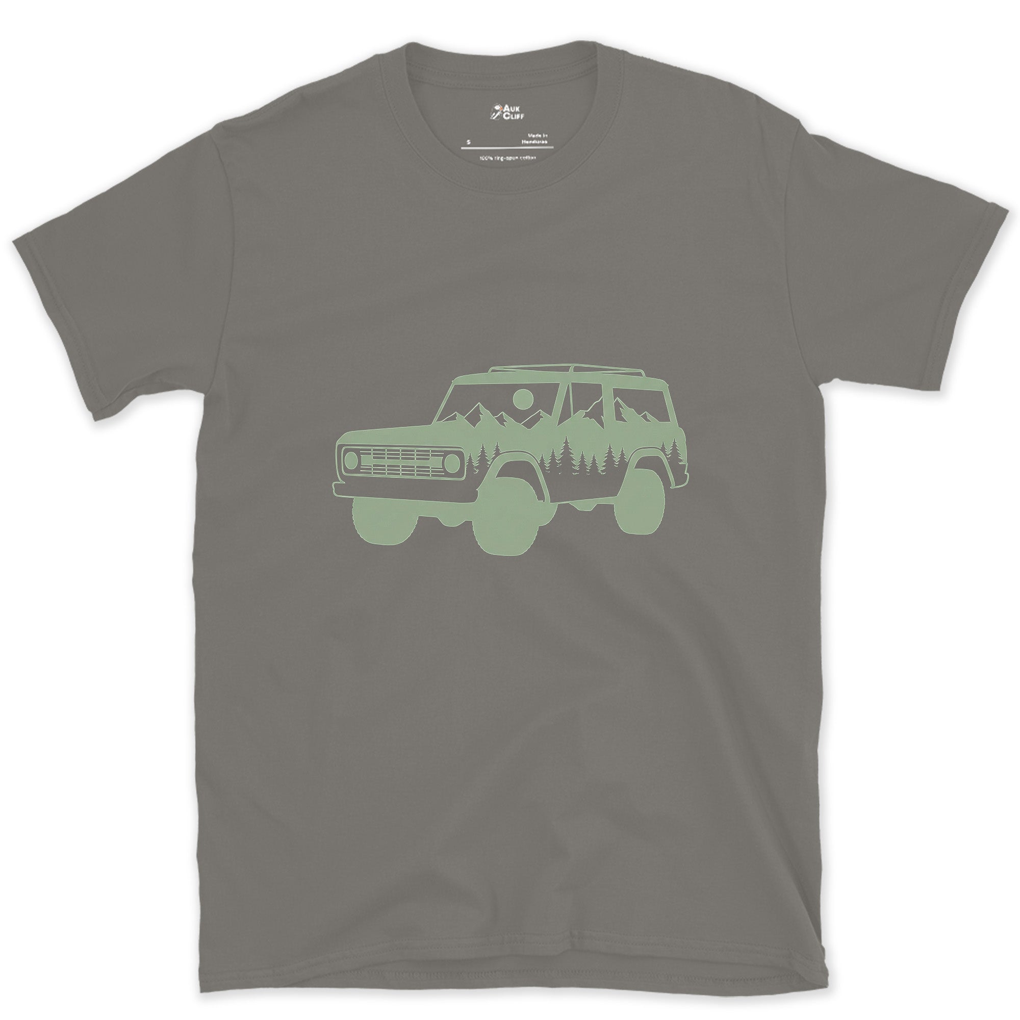 Mountain and Pines Living Inside the Wagon design on a Charcoal Gildan Softstyle t-shirt