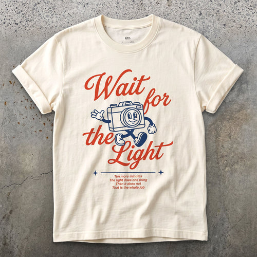 Wait for the Light, Camera design on a Natural Gildan Softstyle t-shirt
