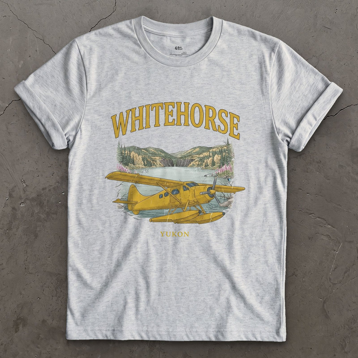 Whitehorse Bush Plane design on a Sport Grey Gildan Softstyle t-shirt