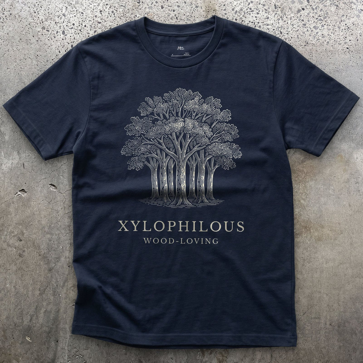 Xylophilous design on a Navy Gildan Softstyle t-shirt