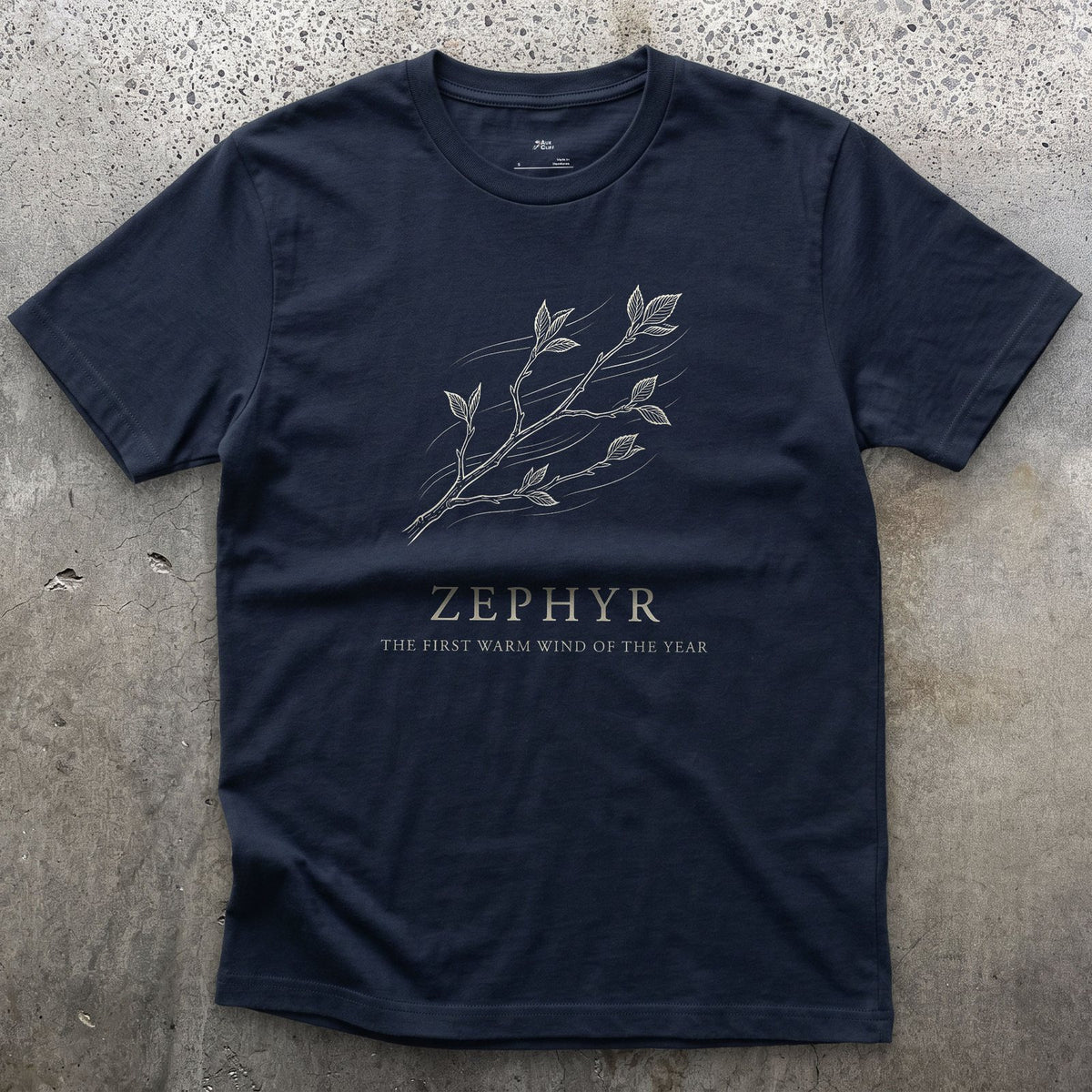 Zephyr, the First Warm Wind of the Year design on a Navy Gildan Softstyle t-shirt