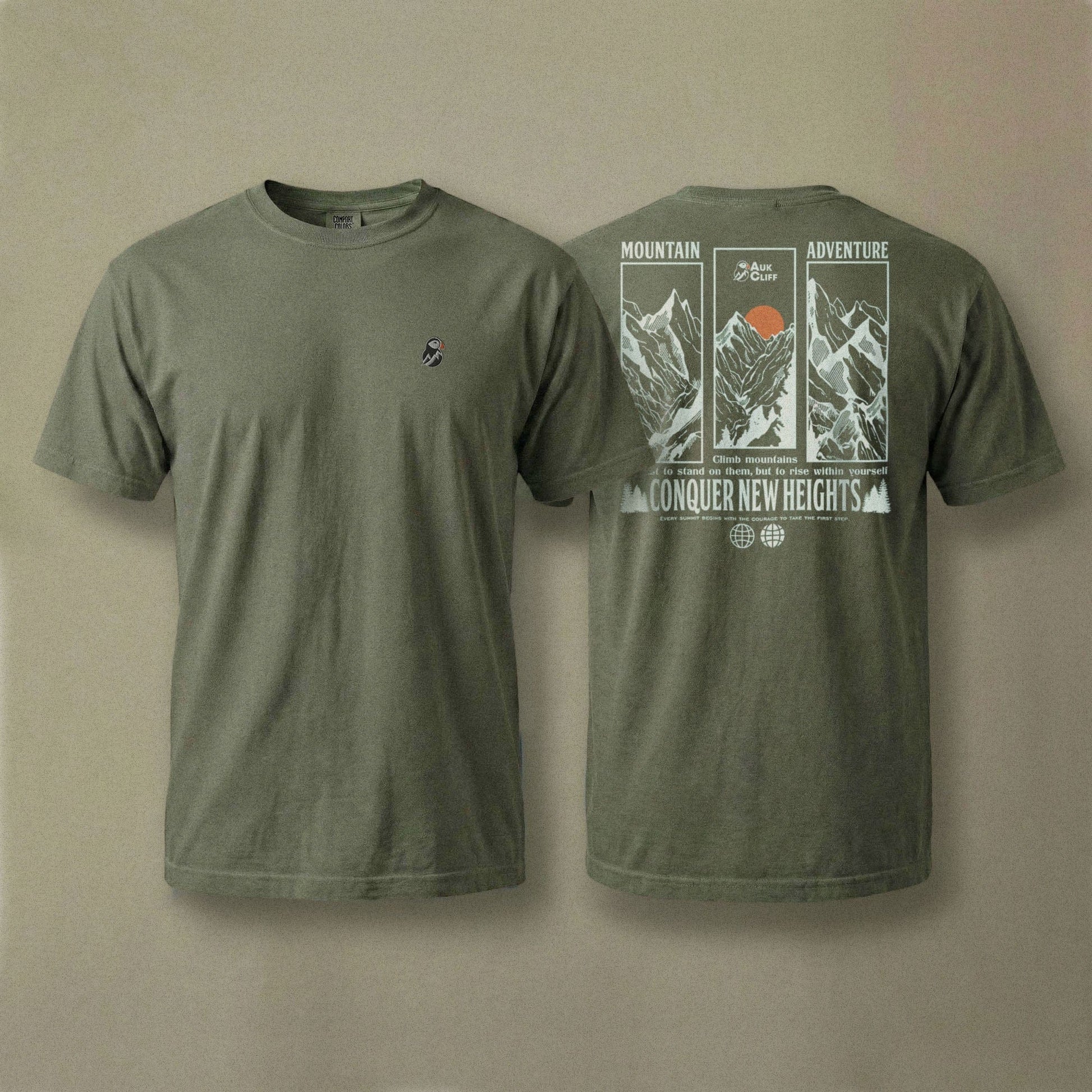 AukCliff Rear Print Comfort Colors T-shirt Moss / S Conquer New Heights Mountain Comfort Colors T-Shirt