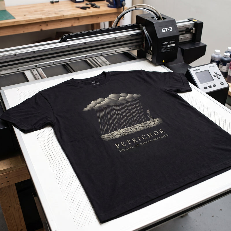 A Field Terms tee on the printer bed, mid job
