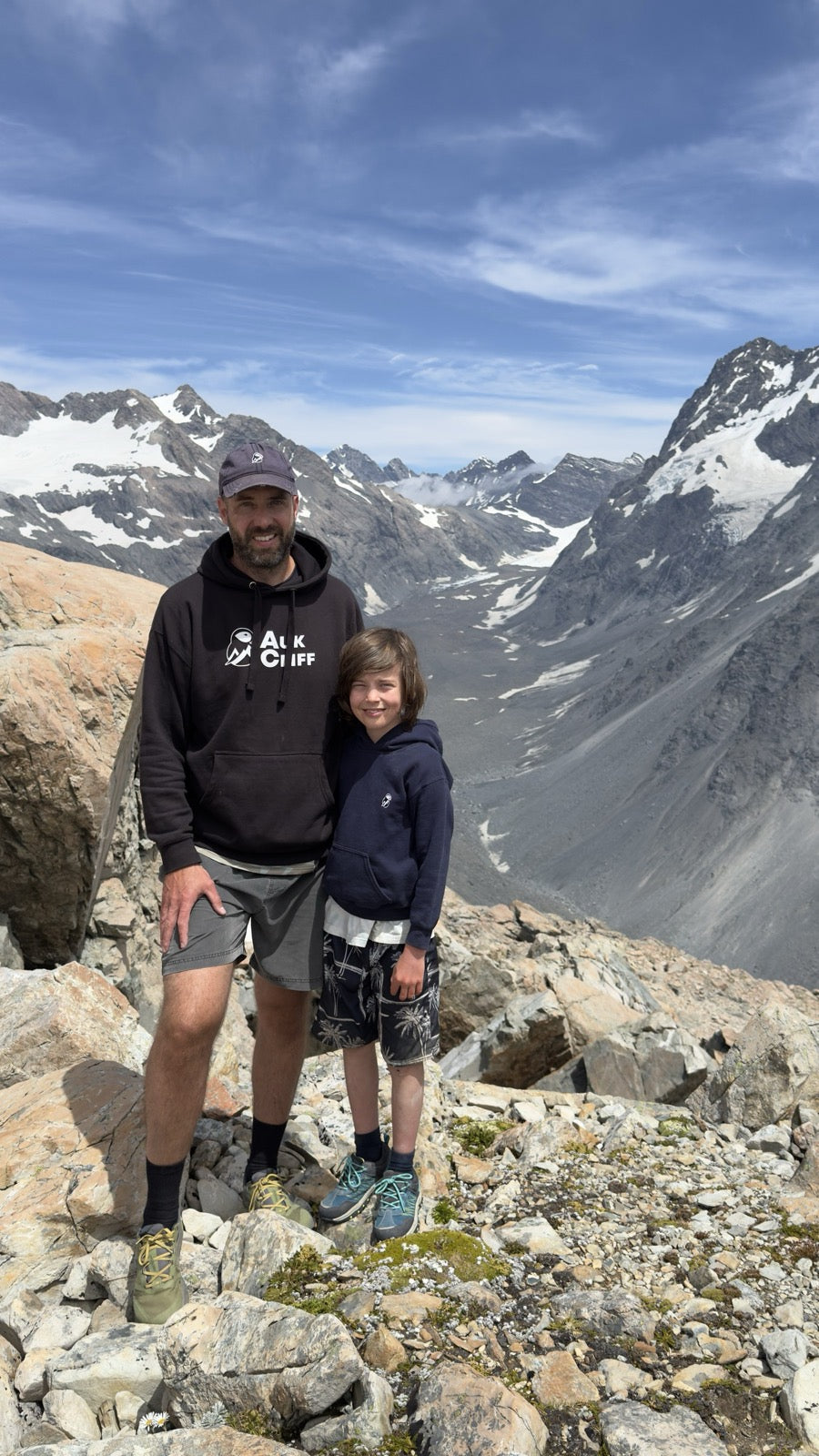 Stephen and his son above a glacier valley, both in AukCliff
