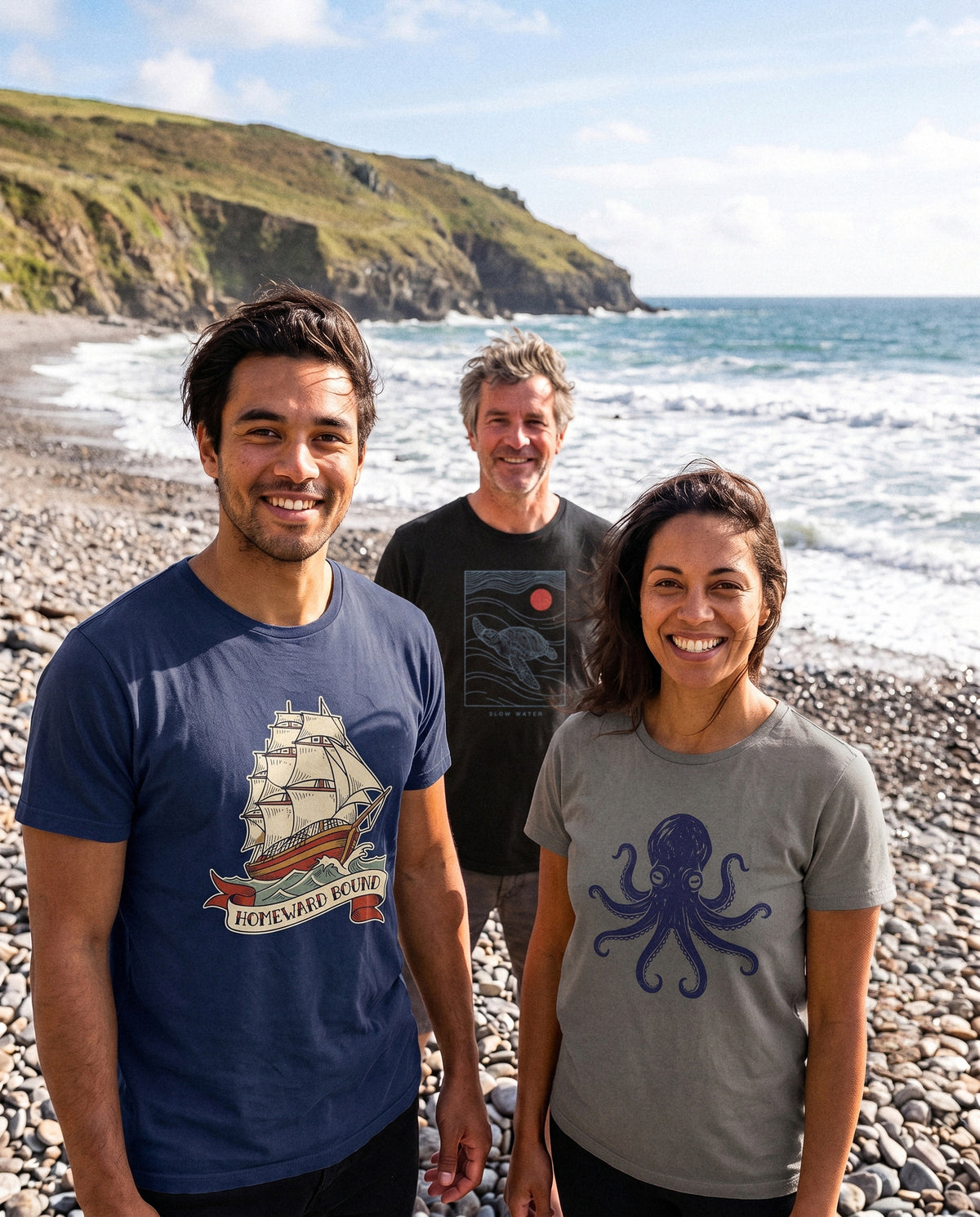 AukCliff t-shirts worn at a shingle beach, photo 1